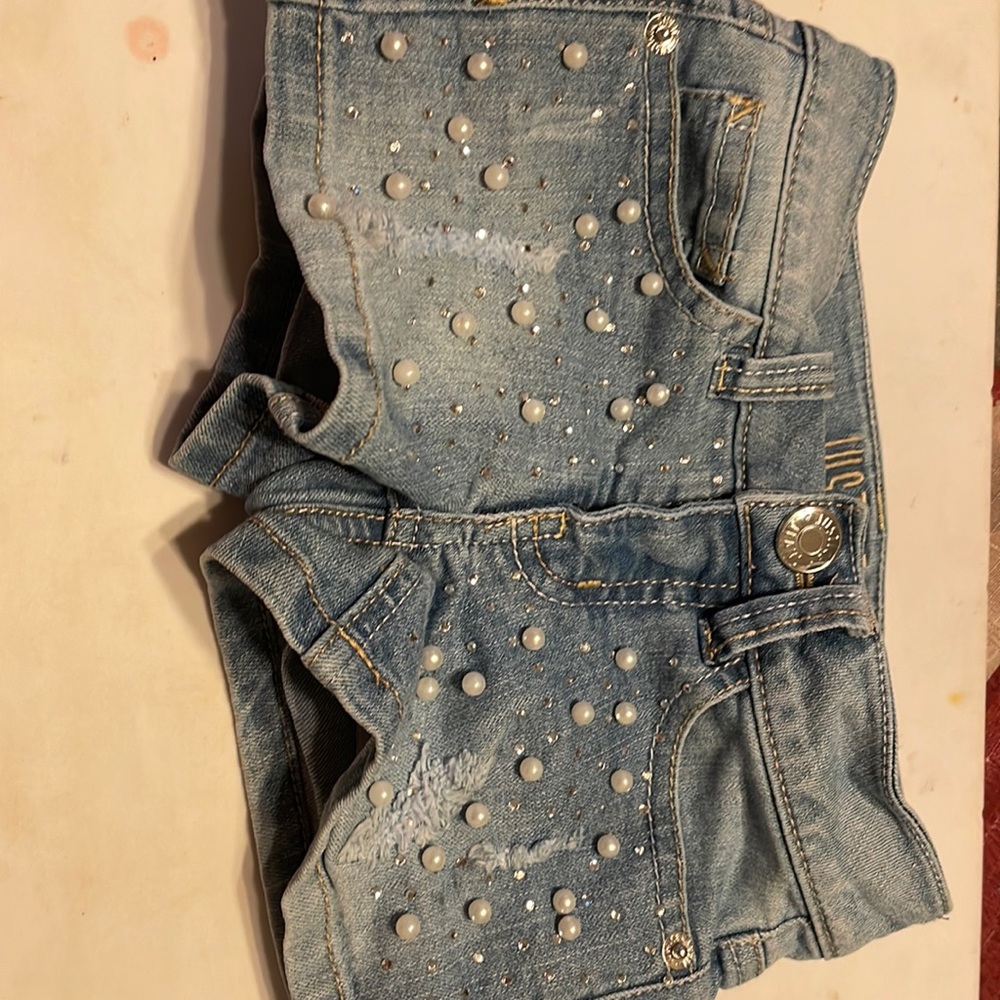 Two pairs of shorts size 5t and 6 t selling together perfect condition